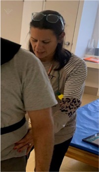 RHRI_Tracey Jackson helping a patient
